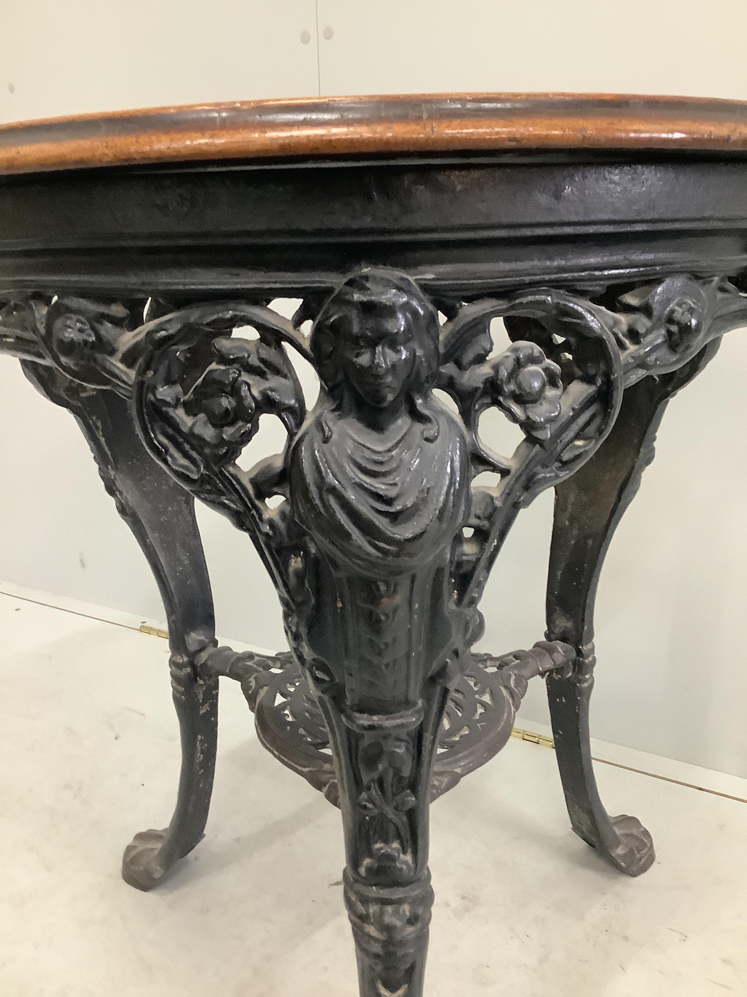 A Victorian circular cast iron and mahogany Britannia pub table, diameter 62cm, height 72cm